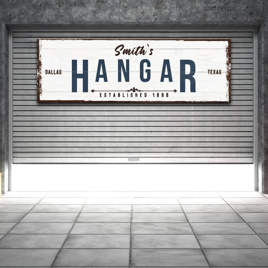 Hangar sign canvas with distressed white wood, blue HANGAR letters Dallas Texas on Tampa Home & Garden Store