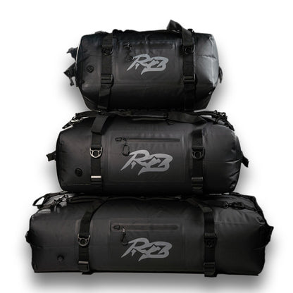 Ridge Bag | Outdoor Duffel Three Pack stacked black duffels with straps and Ridge logo on Tampa Home & Garden Store