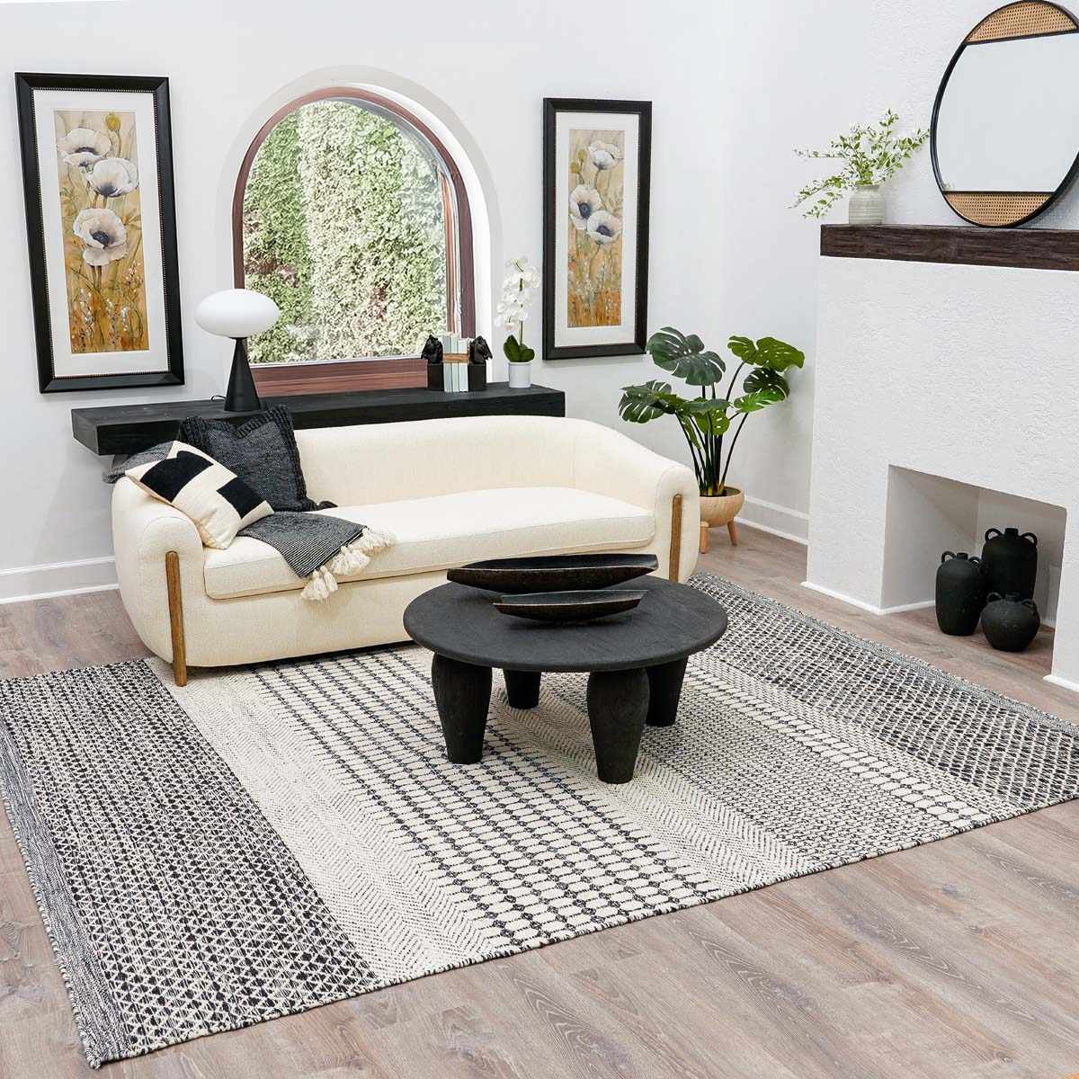 Tideswell Scandi Boho Wool Carpet cream/charcoal woven rug by Boutique Rugs in a cozy living room on Tampa Home & Garden Store