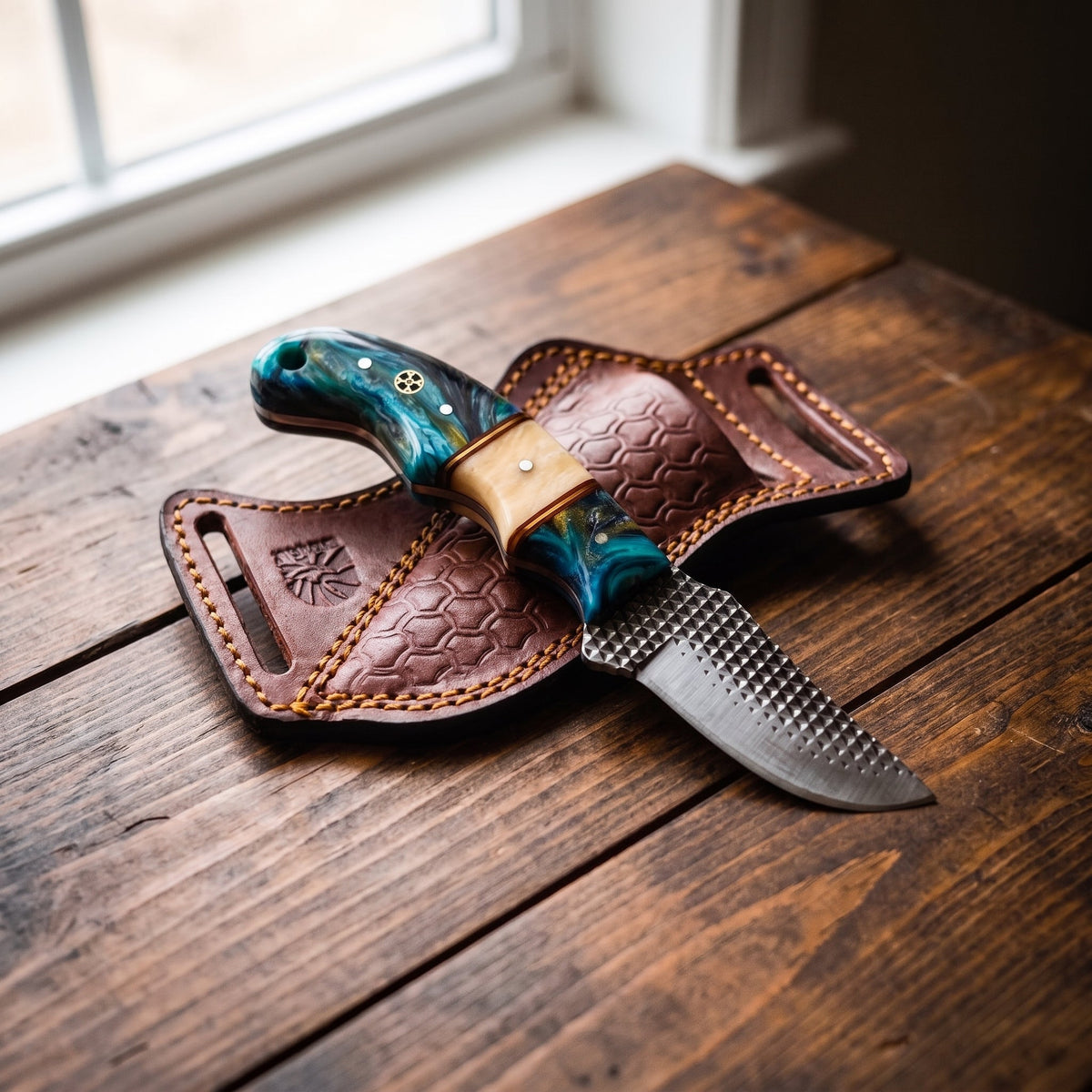 Titan Lagoon Swirl resin skinner with teal handle and high carbon RASP blade in leather sheath on Tampa Home & Garden Store