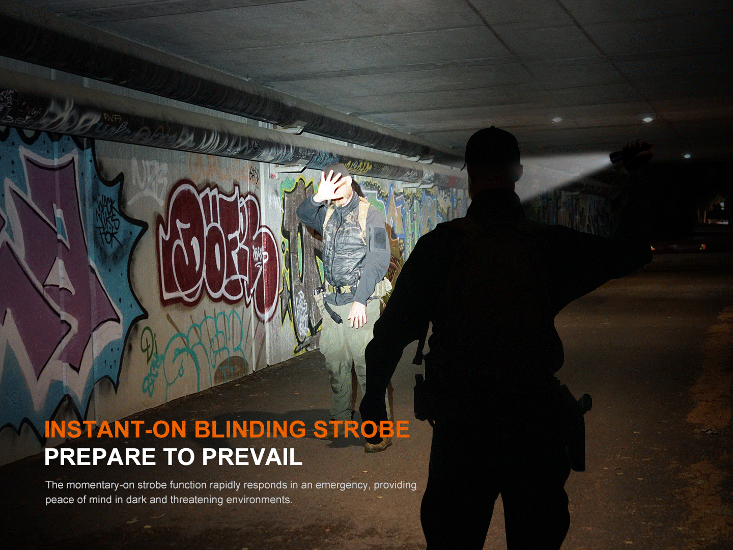 Fenix TK22R rechargeable tactical flashlight in action, bright beam in graffiti-covered tunnel on Tampa Home & Garden Store