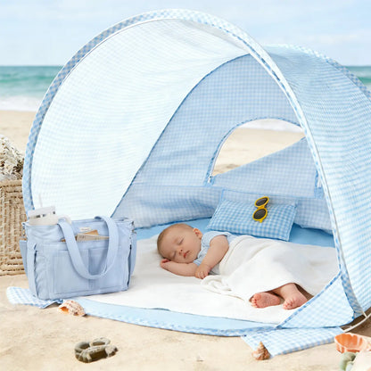 Tiny Land INC One-Stop Beach Toy & Tent Set blue gingham pop-up beach tent with a sleeping baby on a mat on Tampa Home & Garden Store