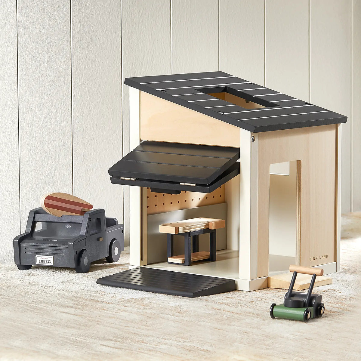 Tiny Land Garage Dollhouse Accessory, wooden with black roof, open interior, green lawn mower on Tampa Home & Garden Store