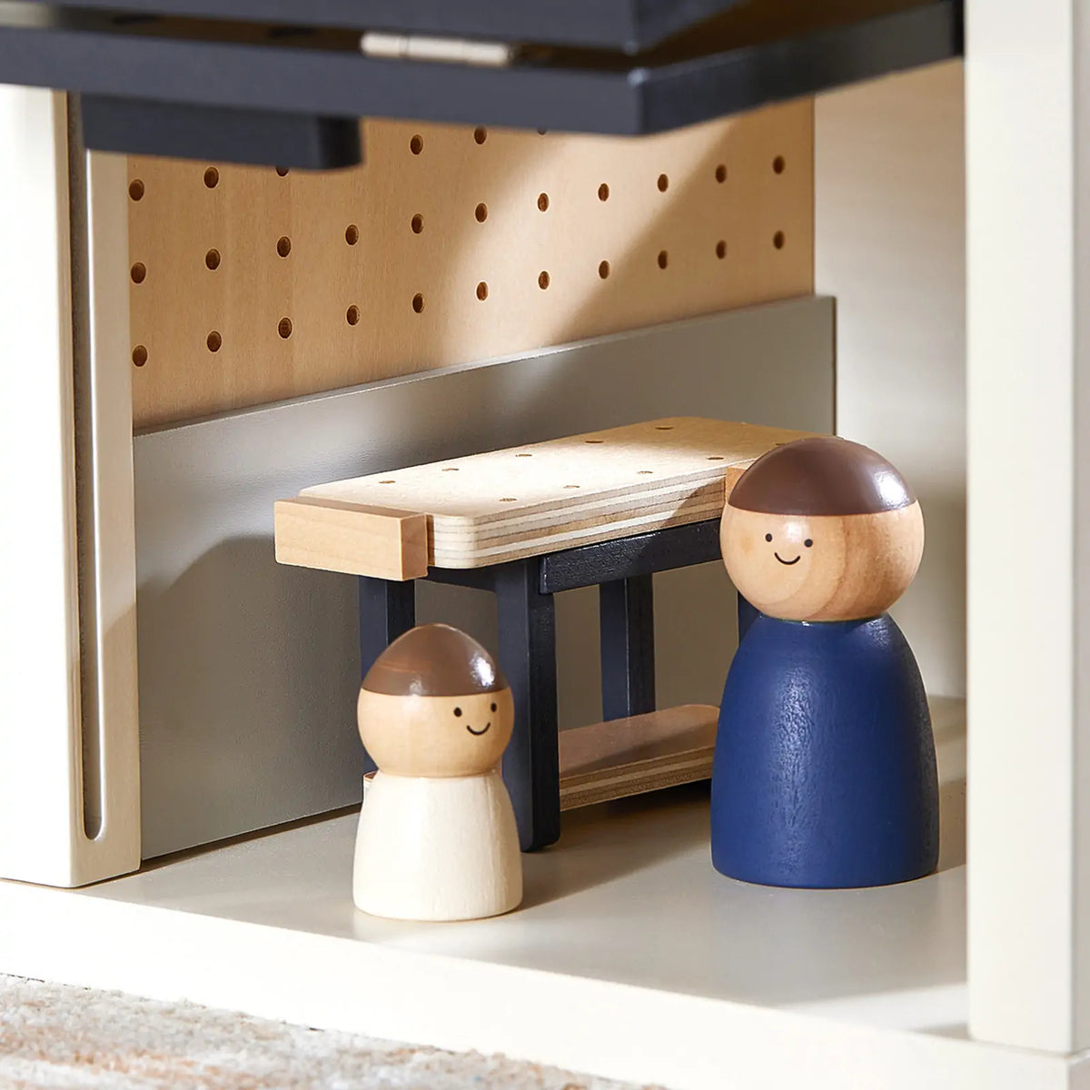 Tiny Land wooden garage dollhouse accessory with pegboard backdrop and wooden figures on Tampa Home & Garden Store