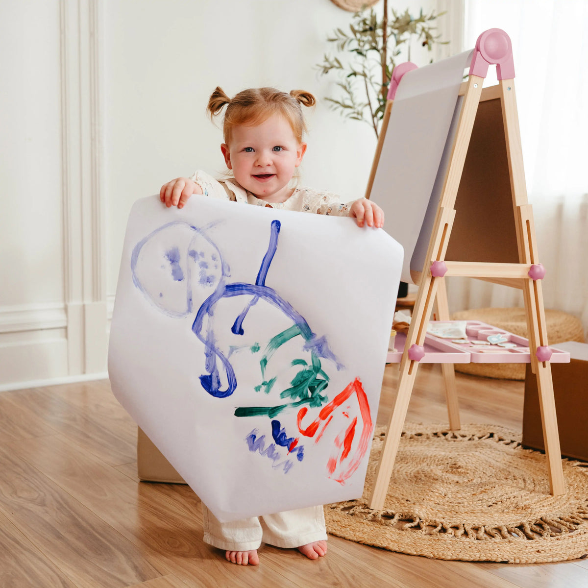 Tiny Land pink Magnitales kids easel with paper roll, child painting a large sheet on Tampa Home & Garden Store