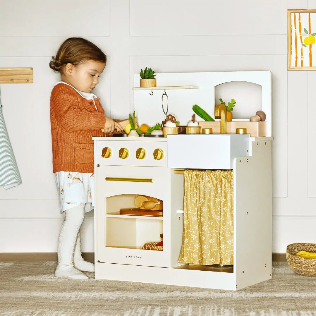 Tiny Land INC wooden play kitchen with honey tones, gold knobs, and fabric curtain on Tampa Home & Garden Store