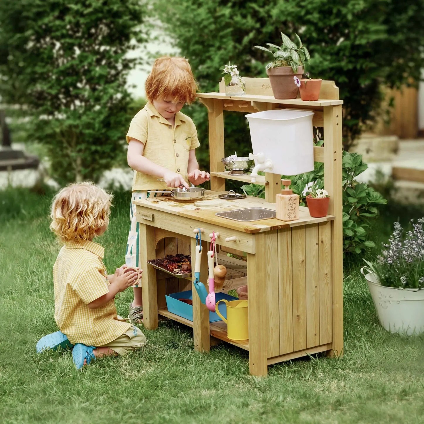 Tiny Land Mud Kitchen DuoPlay outdoor play kitchen for kids, wooden setup with sink and pots on Tampa Home & Garden Store