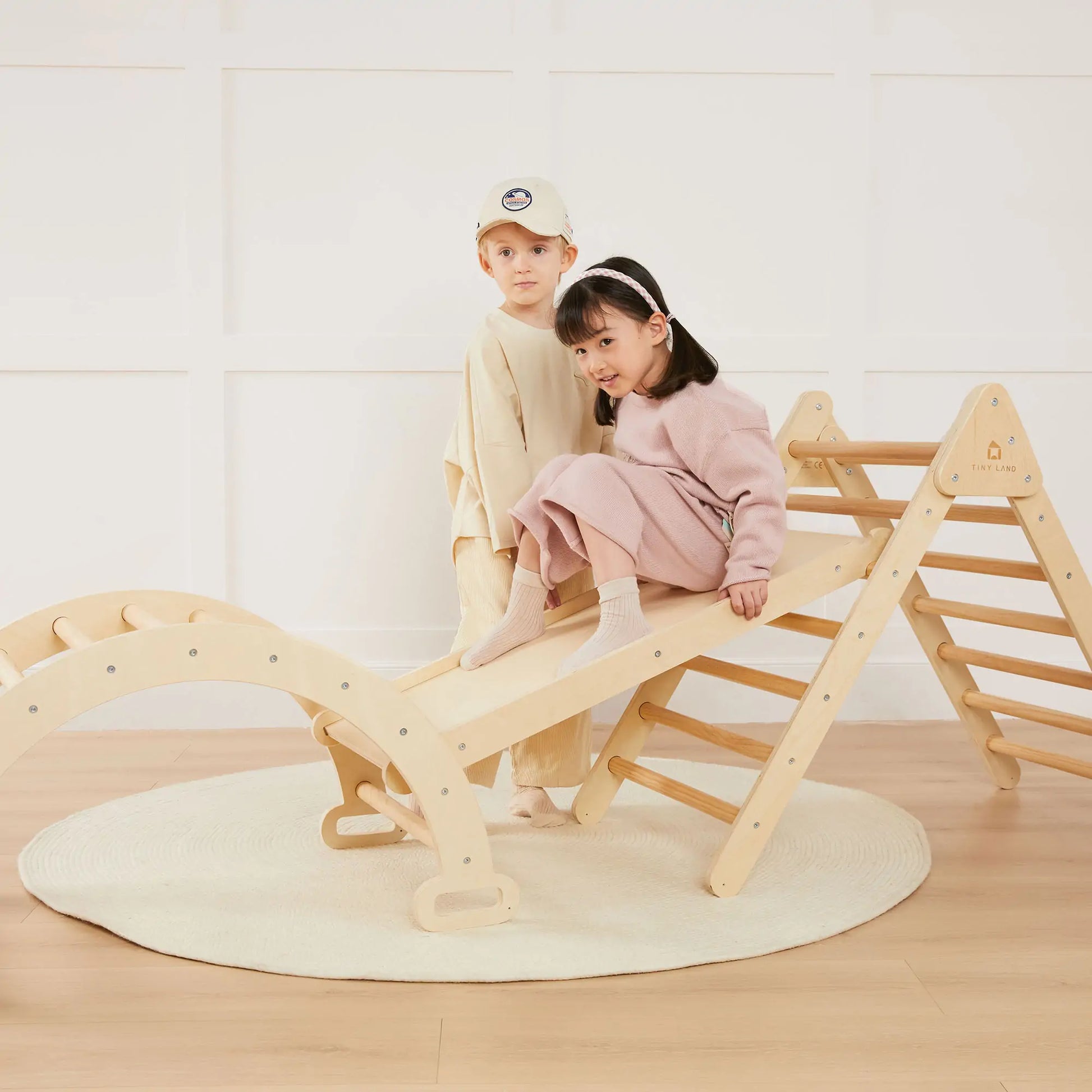 Tiny Land 7-in-1 Montessori climbing set with play pad, natural wood, two kids on Tampa Home & Garden Store