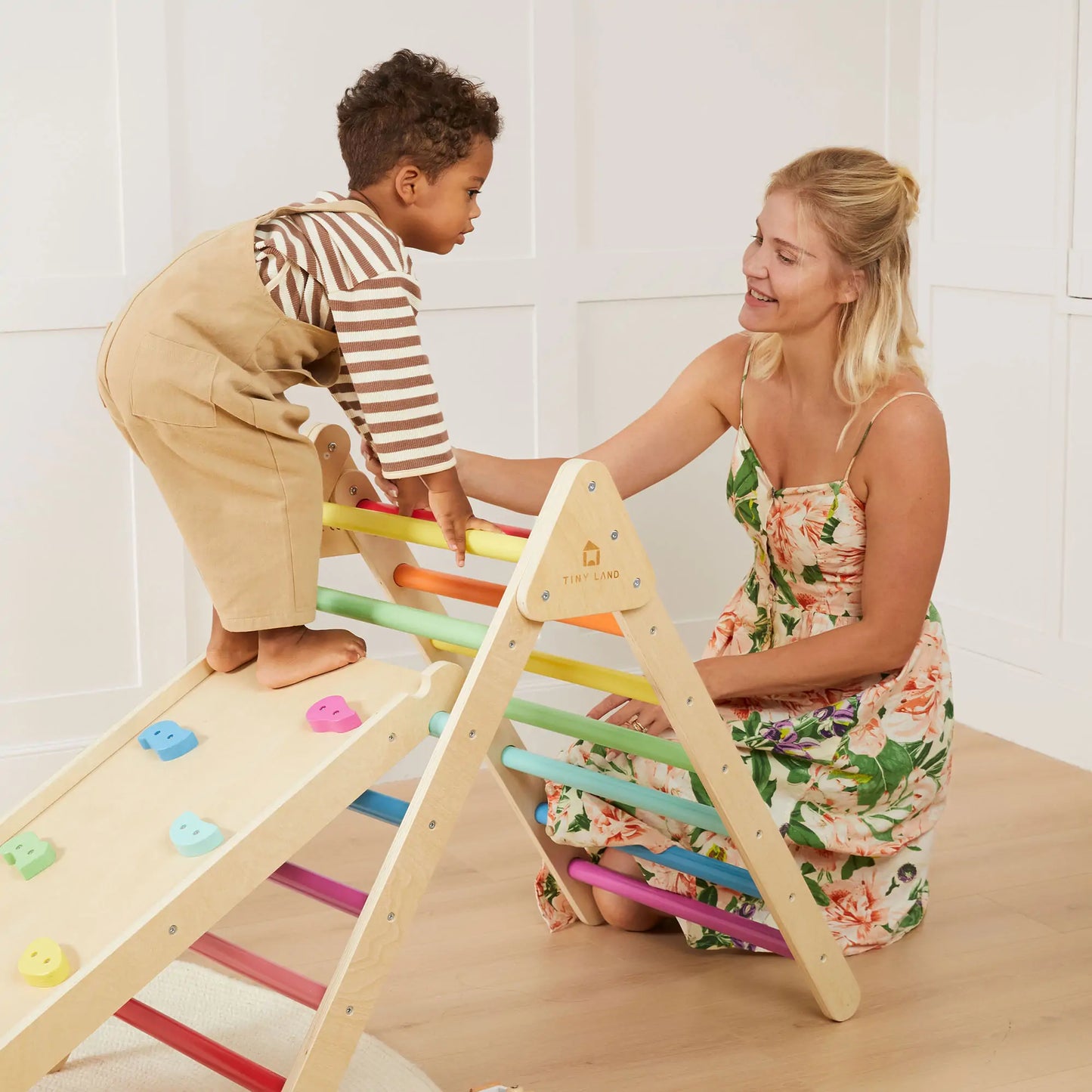 Tiny Land INC Pikler Triangle 7-in-1 climbing set pastel rungs child climbs with caregiver on Tampa Home & Garden Store