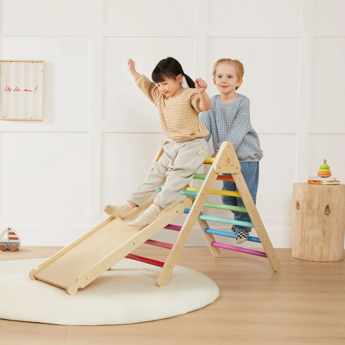 Tiny Land INC Rainbow Climbing Set with Play Pad, wooden ladder with rainbow rungs, two kids on Tampa Home & Garden Store