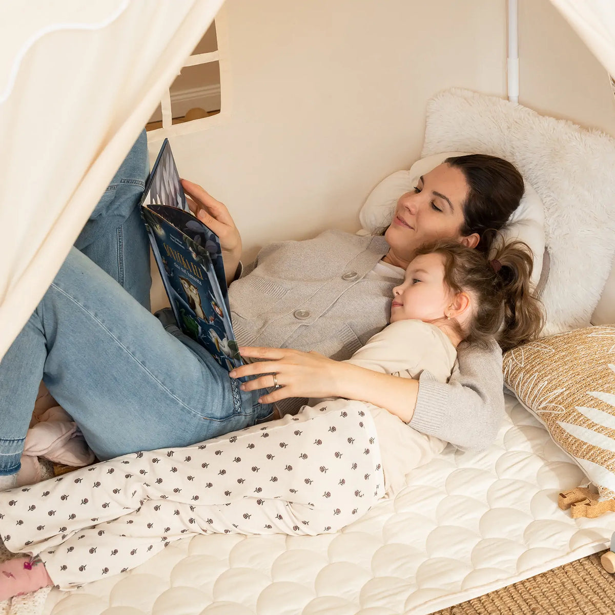 Tiny Land Kids Tent large cozy cream play tent with mother and child reading on a quilted bed on Tampa Home & Garden Store