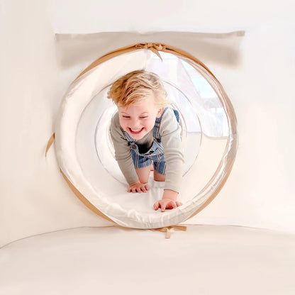 Tiny Land Discovery 5-in-1 Play Tunnel beige fabric with child crawling inside on Tampa Home & Garden Store