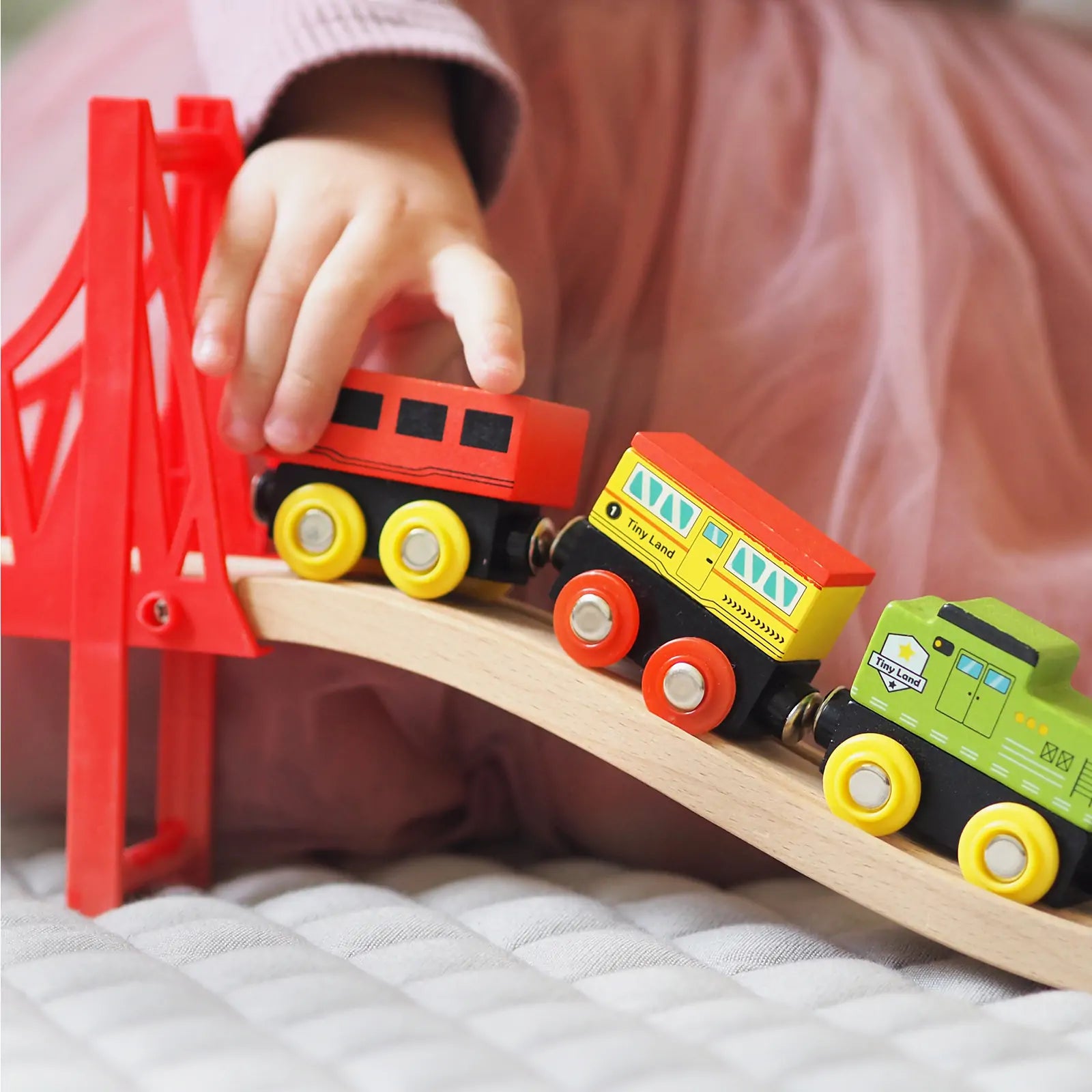 Tiny Land 110-Piece Wooden Train Set with Folding Storage Box on track and red bridge on Tampa Home & Garden Store