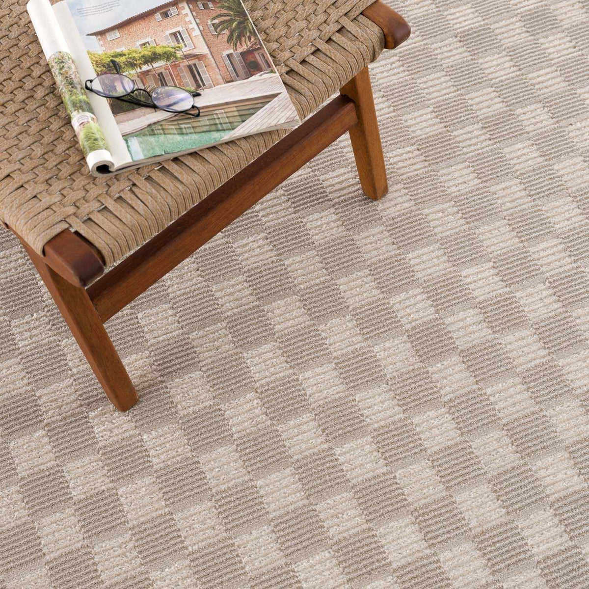 Truls 3D Checkered Washable Rug Biscotti on a wooden bench on Tampa Home & Garden Store
