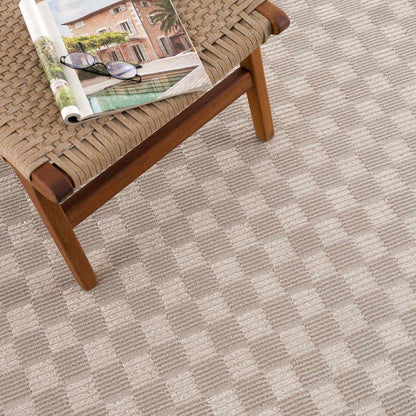Truls 3D Checkered Washable Rug Biscotti on a wooden bench on Tampa Home & Garden Store