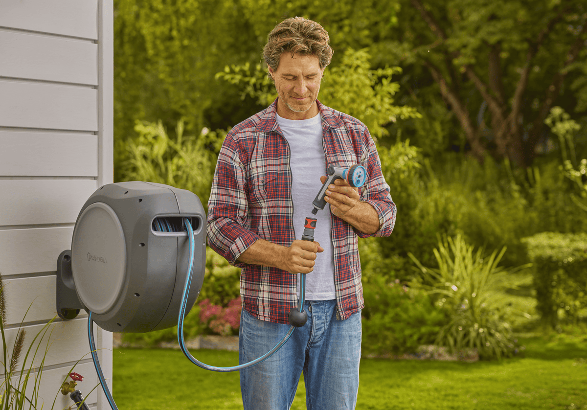 Gardena Retractable Hose Reel RollUp 50 ft auto retracting, wall-mounted with blue hose on Tampa Home & Garden Store
