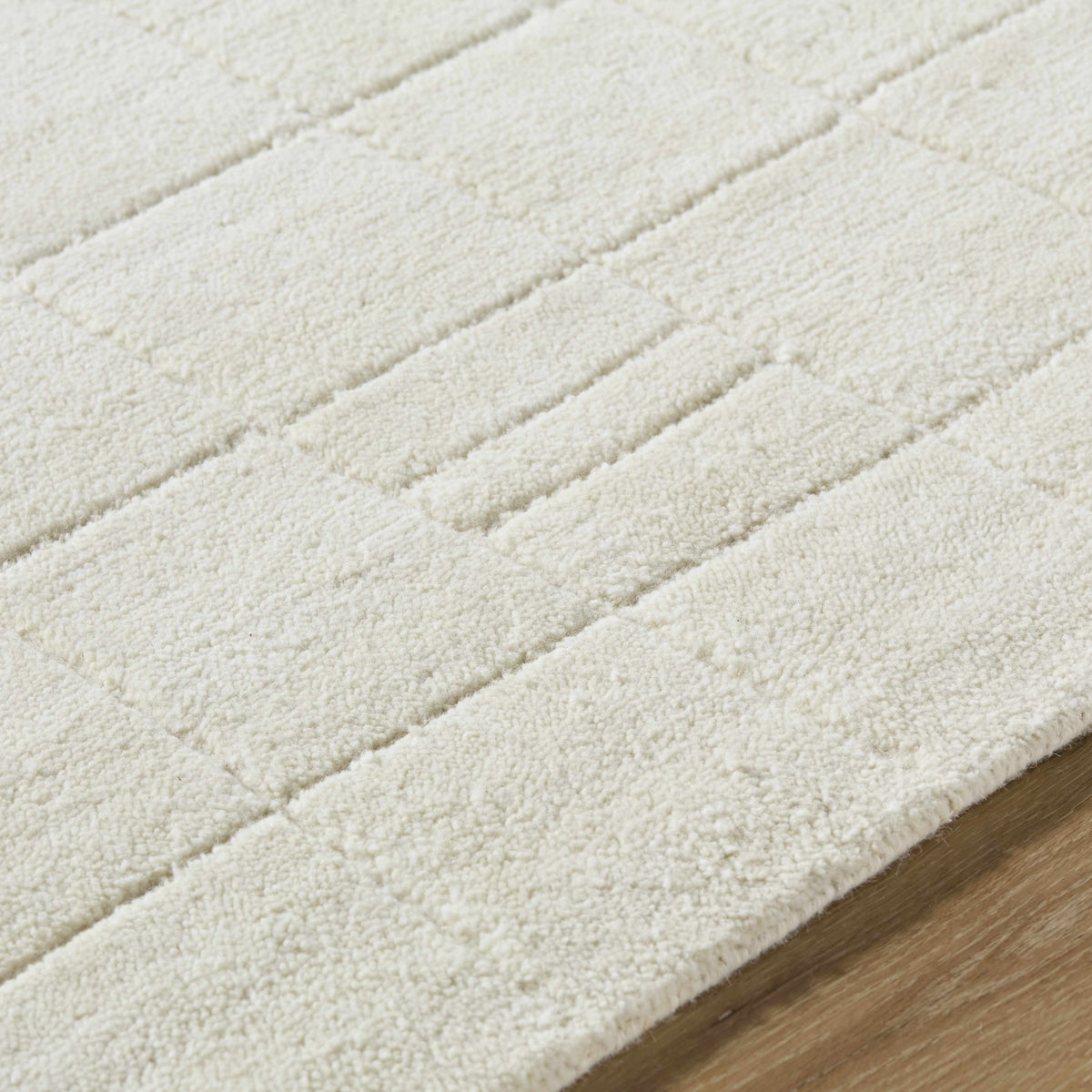 Tuuka Silver Beige Area Rug plush beige pile with diagonal stitched lines Boutique Rugs on Tampa Home & Garden Store