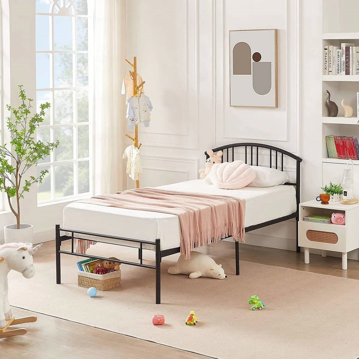 Twin size black metal platform bed frame with arched headboard in a kid's bedroom by HomePacific on Tampa Home & Garden Store