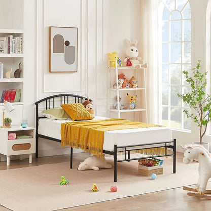 Twin size black metal platform bed frame with arched headboard in a bright kids' room on Tampa Home & Garden Store