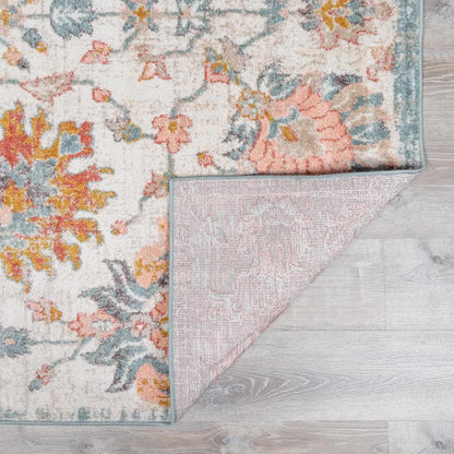 Twilight Floral Area Rug by Boutique Rugs, ivory field with pink blue floral motifs, teal border on Tampa Home & Garden Store