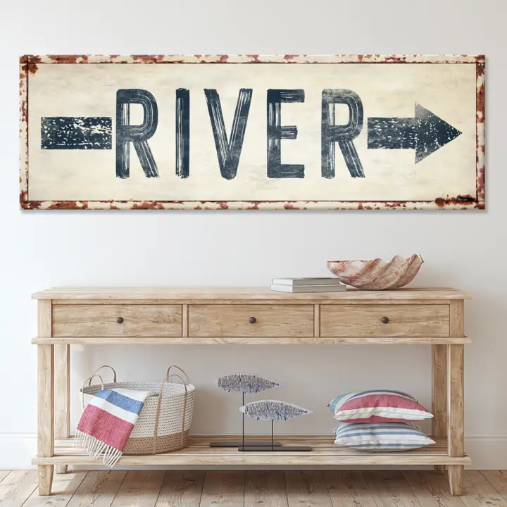 River Arrow Sign canvas wall art, cream background with navy lettering and rust edge on Tampa Home & Garden Store