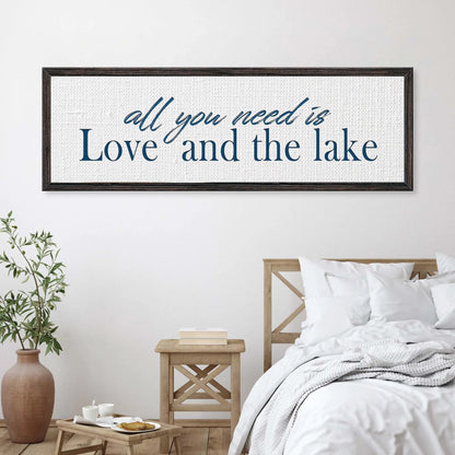Framed canvas wall art with navy script that reads all you need is Love and the lake on Tampa Home & Garden Store