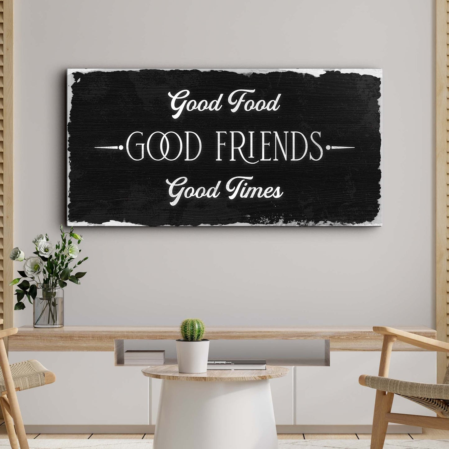 Canvas sign with white scripted Good Food Good Friends Good Times on distressed black canvas on Tampa Home & Garden Store