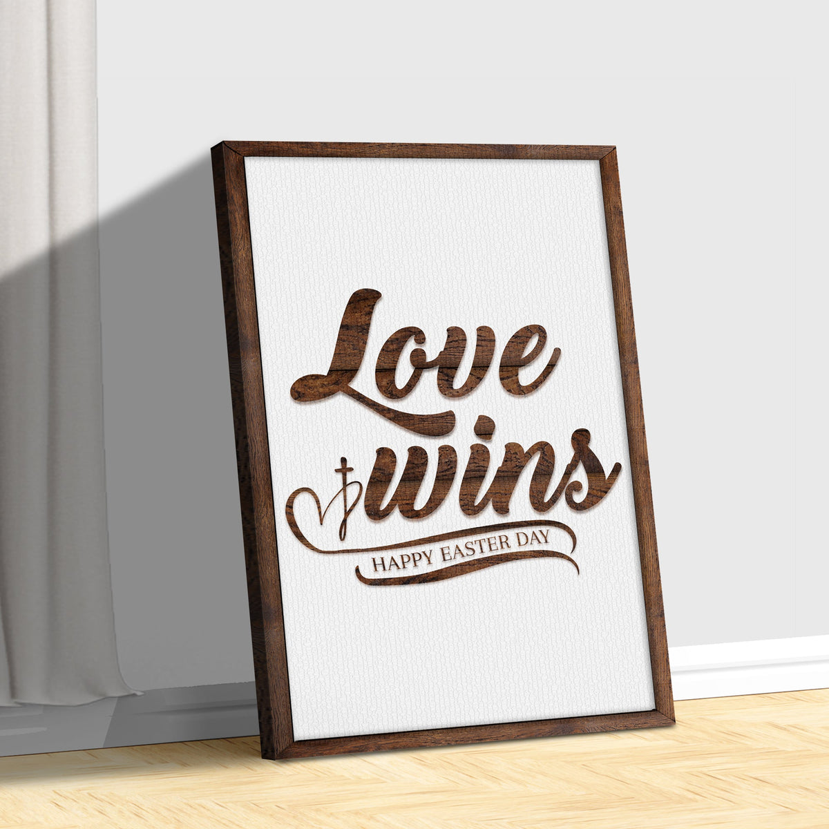 Canvas sign Easter Love Wins by Tailored Canvases in a brown wood frame leaning on wall on Tampa Home & Garden Store