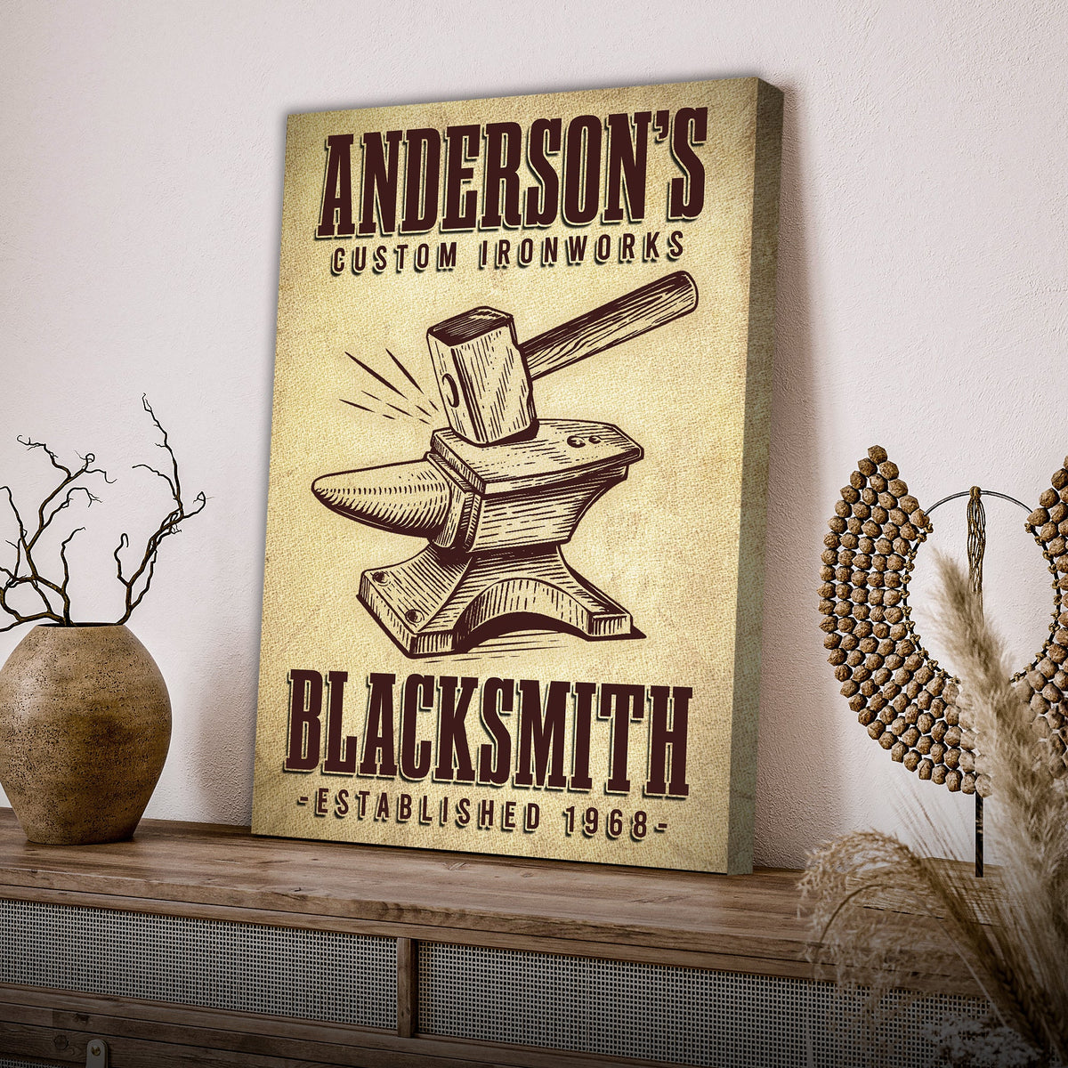 Canvas sign beige with Anderson's Custom Ironworks and a vintage anvil hammer illustration on Tampa Home & Garden Store