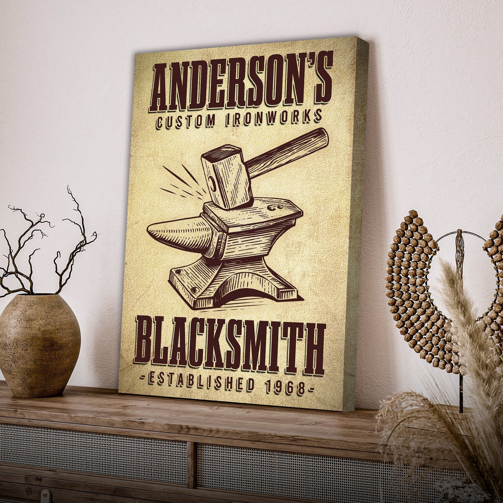 Canvas sign beige with Anderson's Custom Ironworks and a vintage anvil hammer illustration on Tampa Home & Garden Store