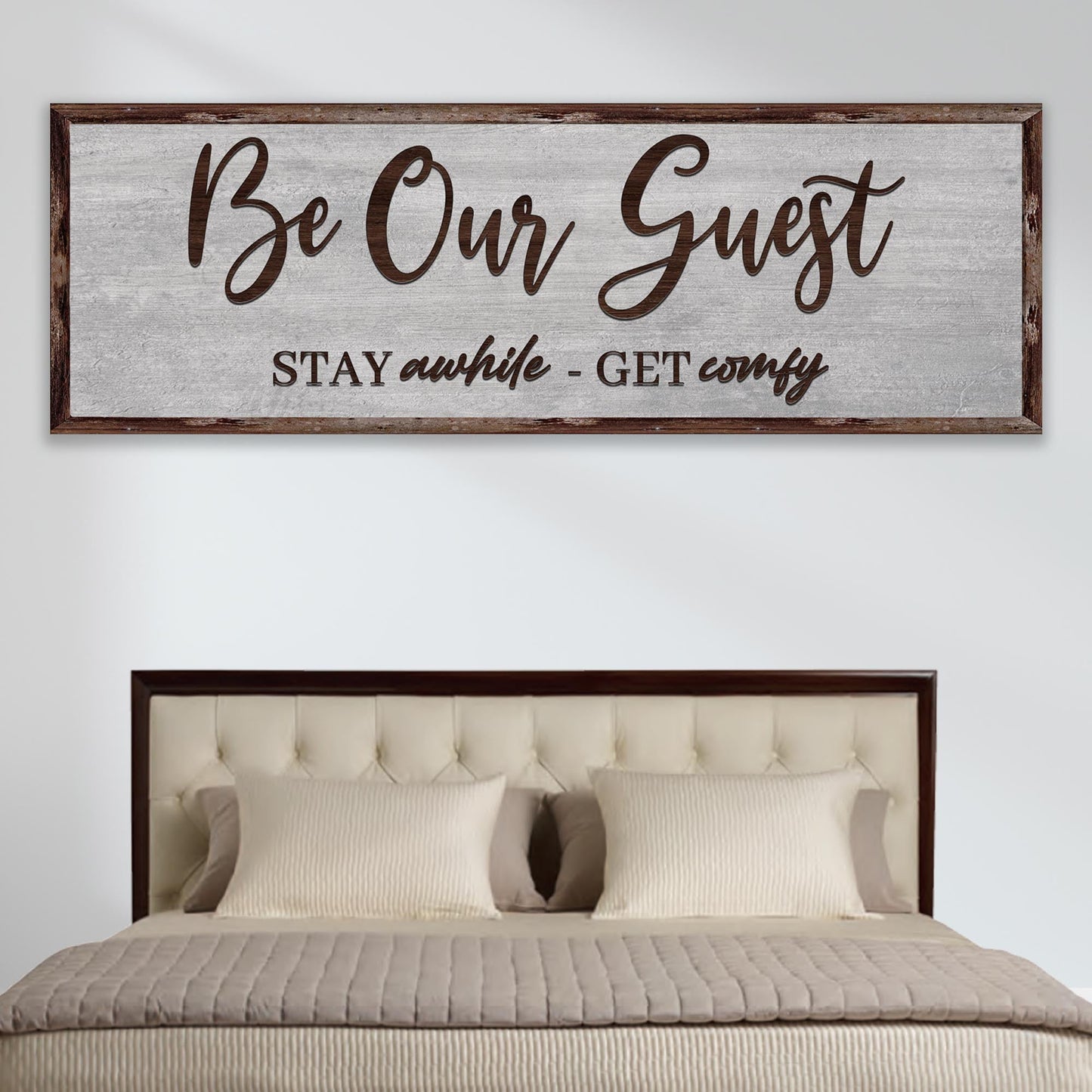 Be Our Guest Sign III canvas with rustic wood frame above a bed Tailored Canvases canvas on Tampa Home & Garden Store