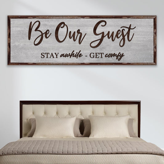 Be Our Guest Sign III canvas with rustic wood frame above a bed Tailored Canvases canvas on Tampa Home & Garden Store