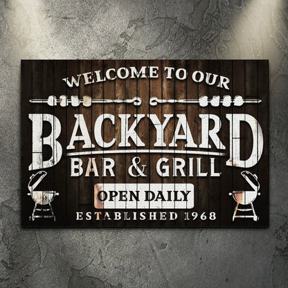 Canvas sign Tailored Canvases Welcome To Our Backyard Bar & Grill on dark wood planks on Tampa Home & Garden Store