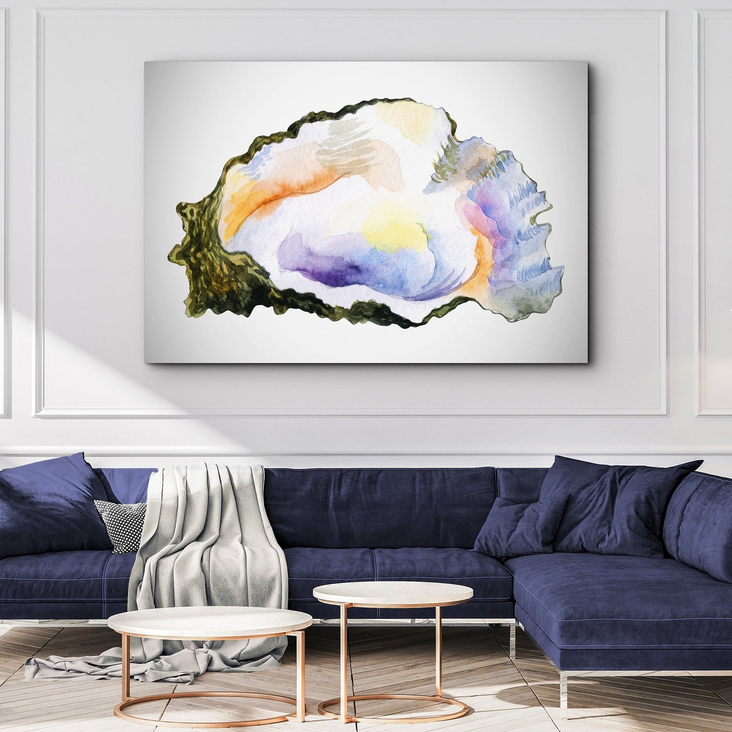 Oyster Watercolor Canvas Wall Art with pastel shell hues, shown above navy sofa on Tampa Home & Garden Store