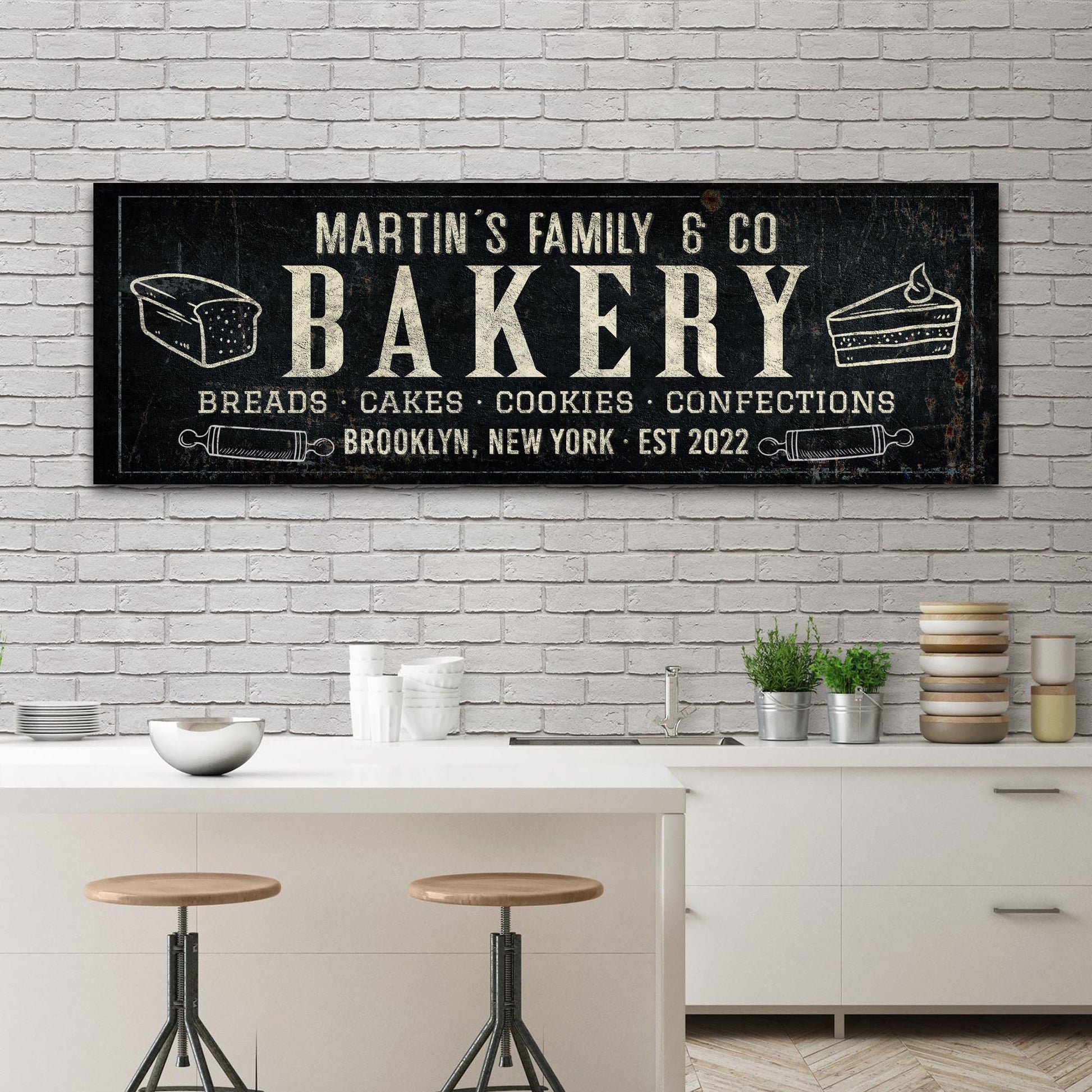 Bakery sign canvas wall art black background ivory lettering and bread loaf and cake icons on Tampa Home & Garden Store