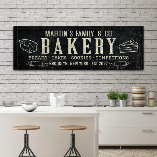 Bakery sign canvas wall art black background ivory lettering and bread loaf and cake icons on Tampa Home & Garden Store