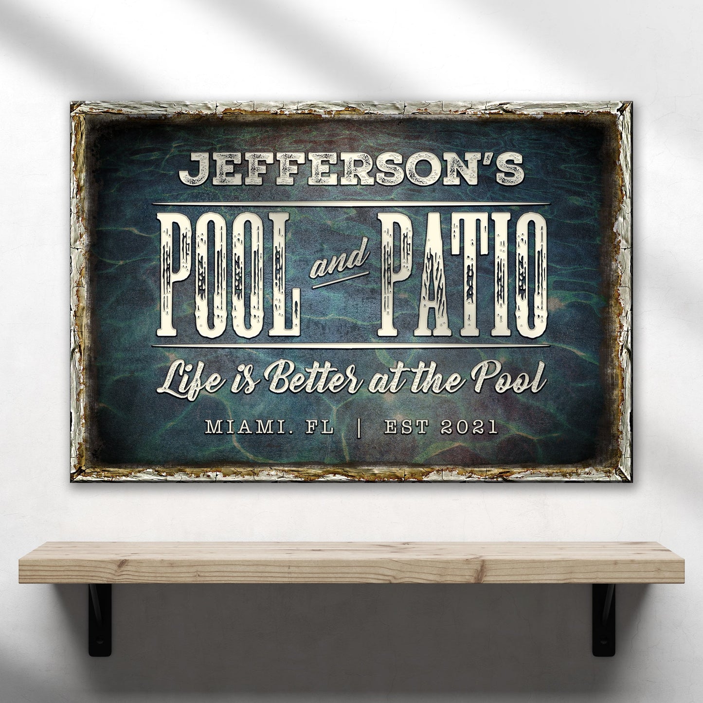 Pool and Patio Sign canvas by Tailored Canvases with a distressed frame and vintage typography on Tampa Home & Garden Store