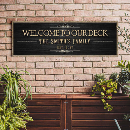 Welcome To Our Deck canvas sign by Tailored Canvases with gold lettering on black plaque on Tampa Home & Garden Store