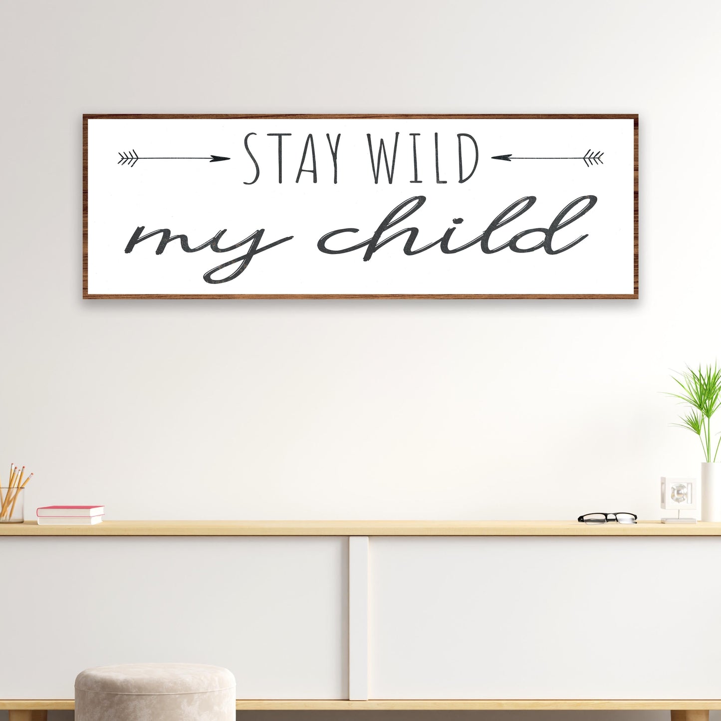 Stay Wild My Child canvas sign, white with black script and arrows, wood frame on Tampa Home & Garden Store
