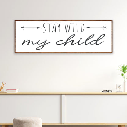 Stay Wild My Child canvas sign, white with black script and arrows, wood frame on Tampa Home & Garden Store