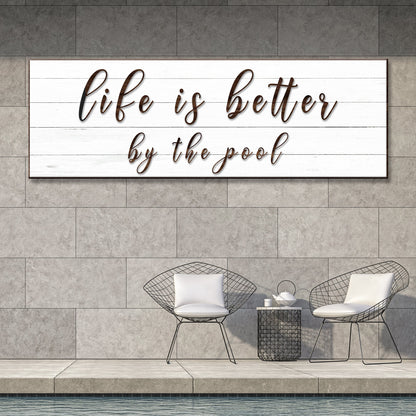 Canvas sign Life Is Better By The Pool in brown cursive on white wood planks by Tailored Canvases on Tampa Home & Garden Store