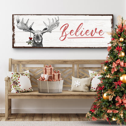 Believe Sign III canvas by Tailored Canvases on pale wood with red script and moose illustration on Tampa Home & Garden Store