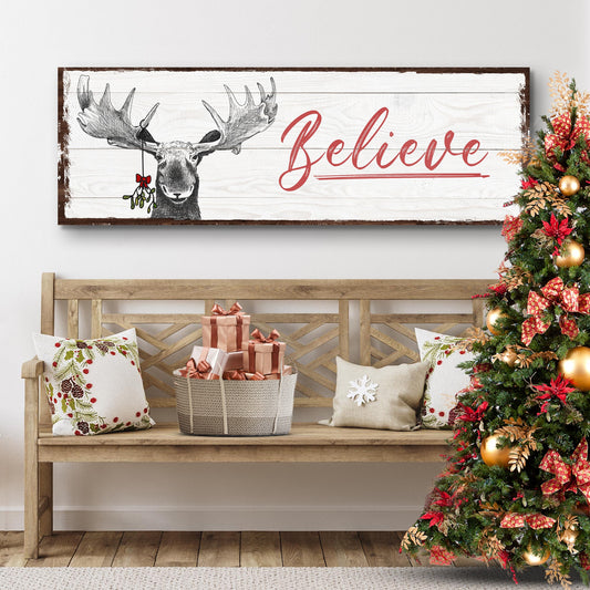 Believe Sign III canvas by Tailored Canvases on pale wood with red script and moose illustration on Tampa Home & Garden Store