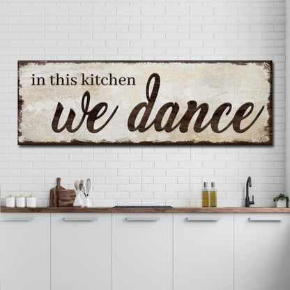 Canvas sign In This Kitchen We Dance with a distressed beige background and brown script on Tampa Home & Garden Store
