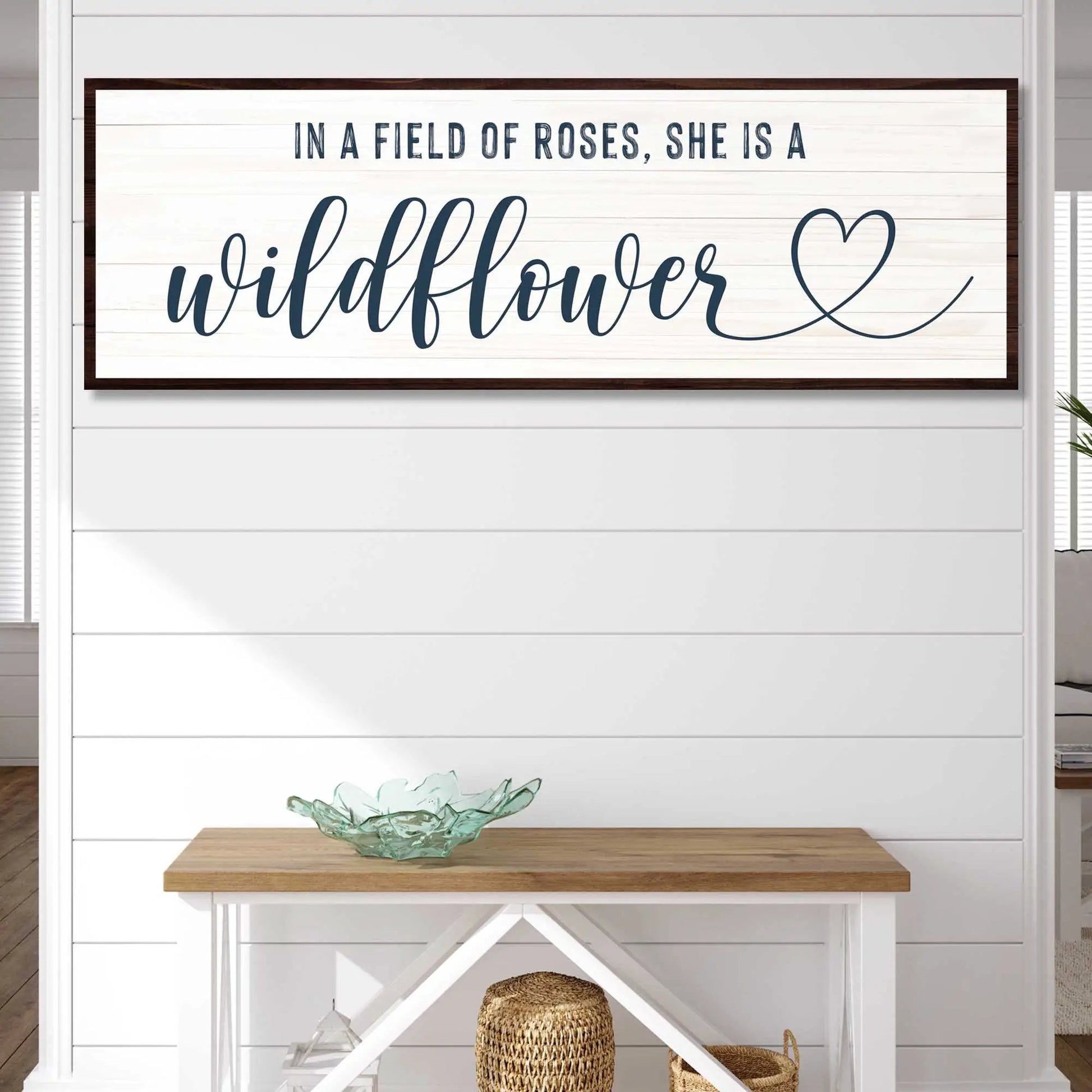 Canvas sign She Is A Wildflower II; navy cursive wildflower on white planked panel with frame on Tampa Home & Garden Store