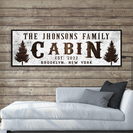Family Cabin Sign II canvas by Tailored Canvases, white sign with brown text and pine trees on Tampa Home & Garden Store