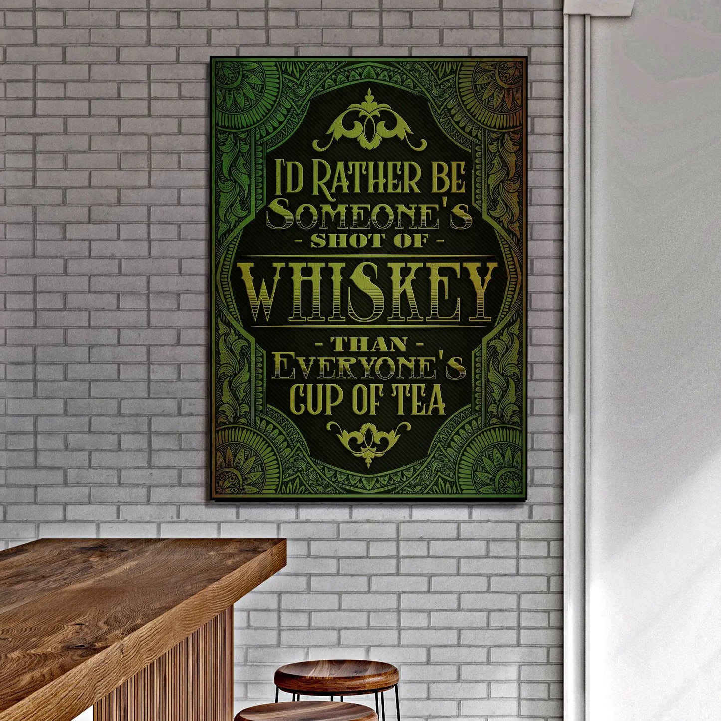 Whiskey Sign crafting canvas by Tailored Canvases with green and gold ornate border on brick wall on Tampa Home & Garden Store