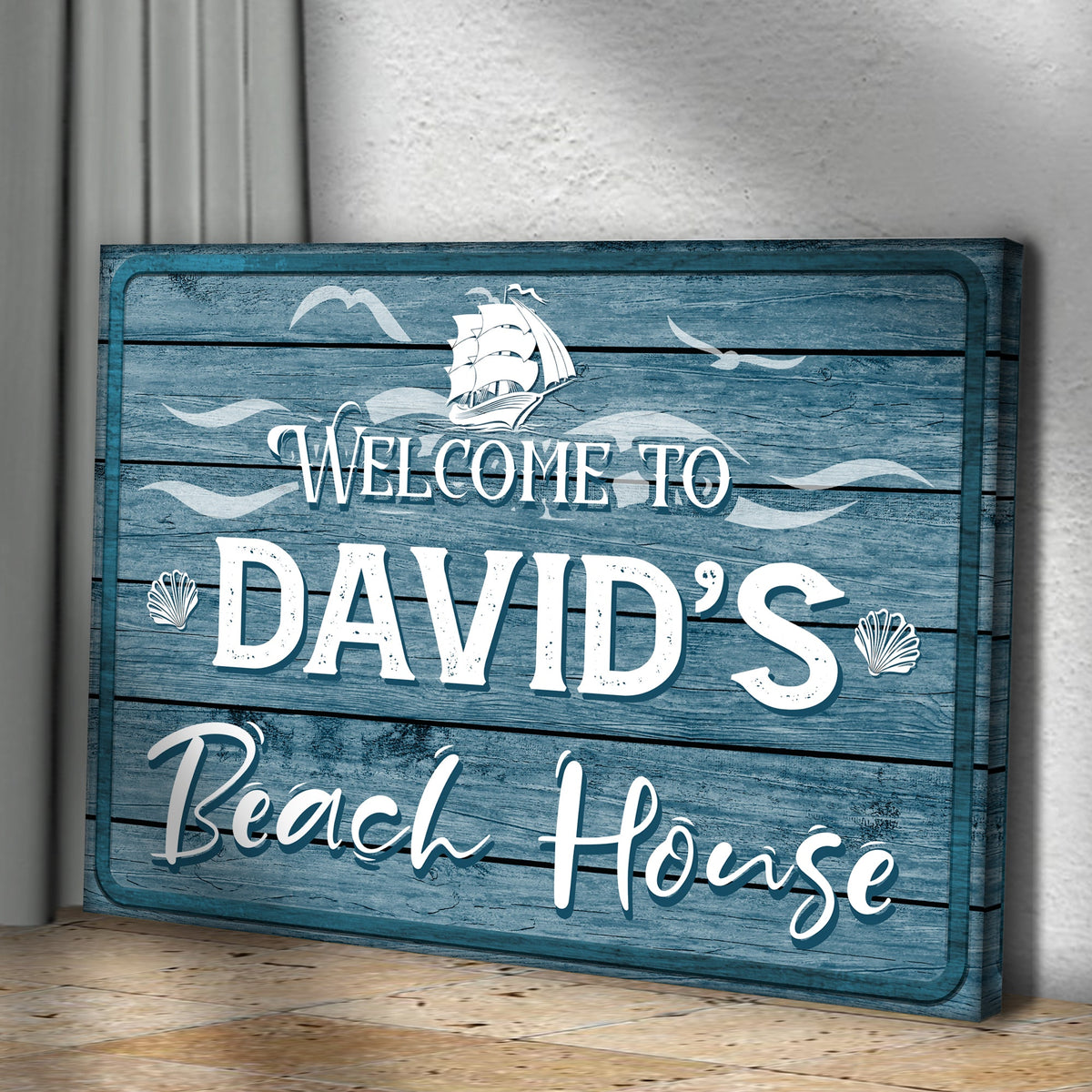 Beach House Welcome Sign canvas on blue distressed wood with white script and shell accents on Tampa Home & Garden Store