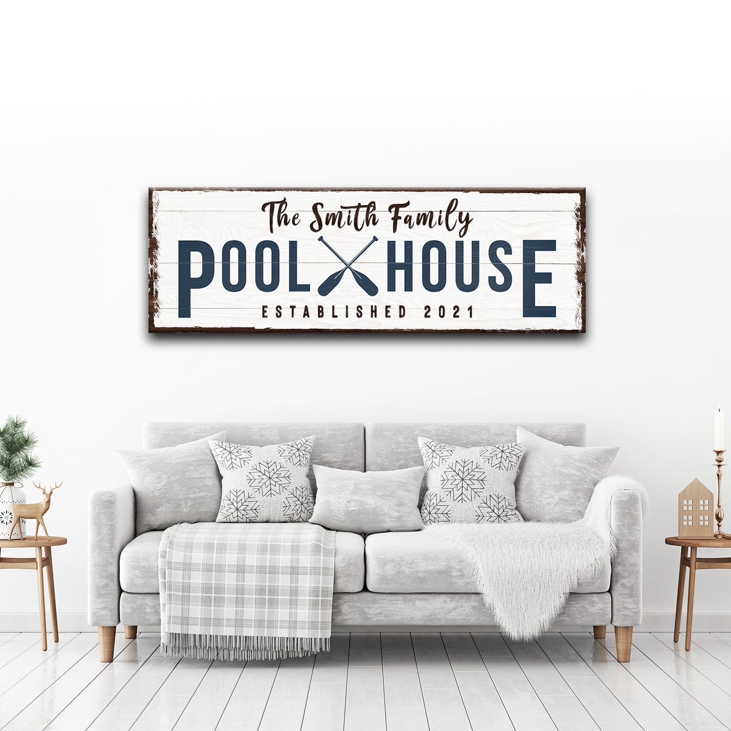 Family Pool House canvas sign with distressed white wood navy letters and paddles brown frame on Tampa Home & Garden Store