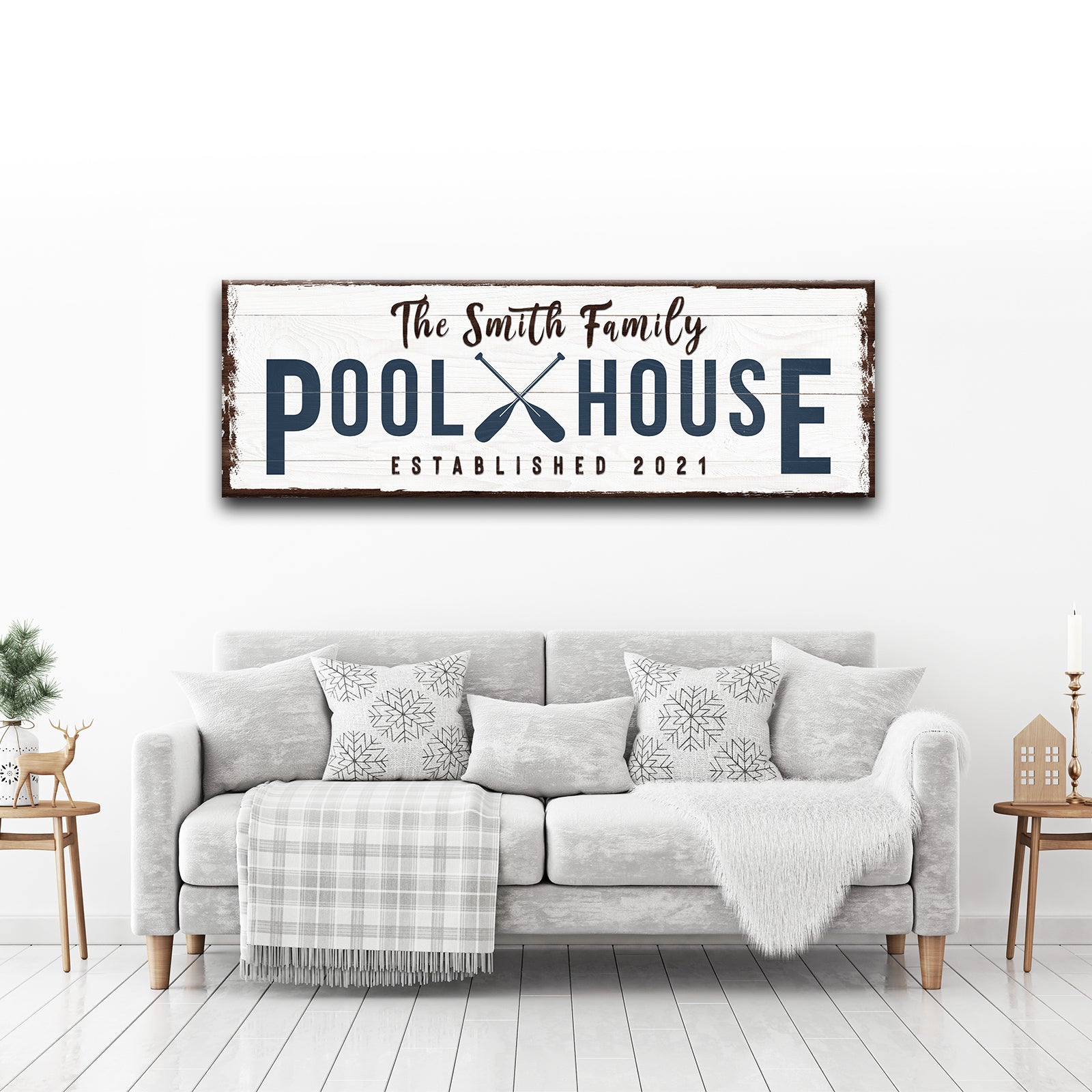 Family Pool House canvas sign with distressed white wood navy letters and paddles brown frame on Tampa Home & Garden Store